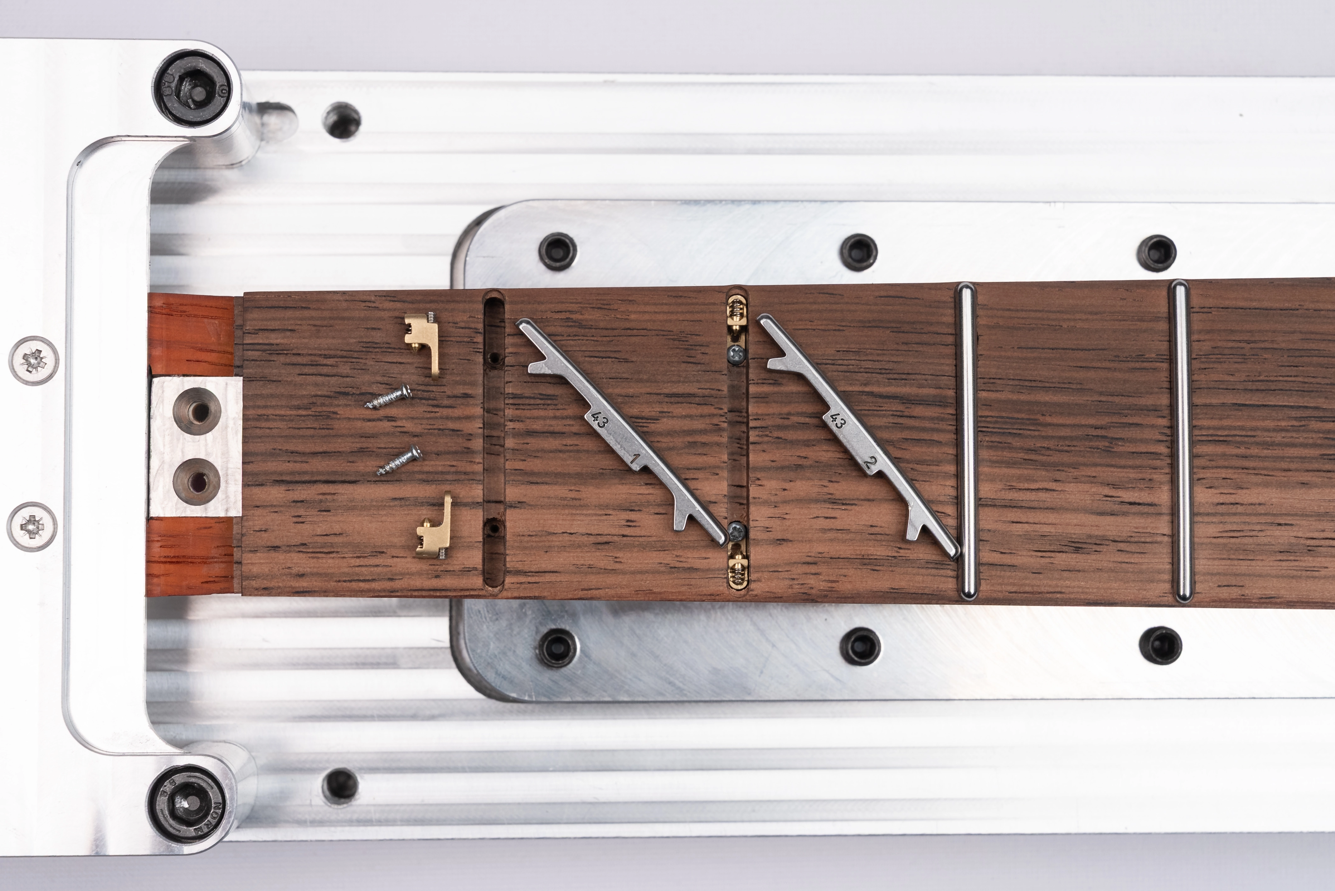 Fretboard routing with brass adapters - top view