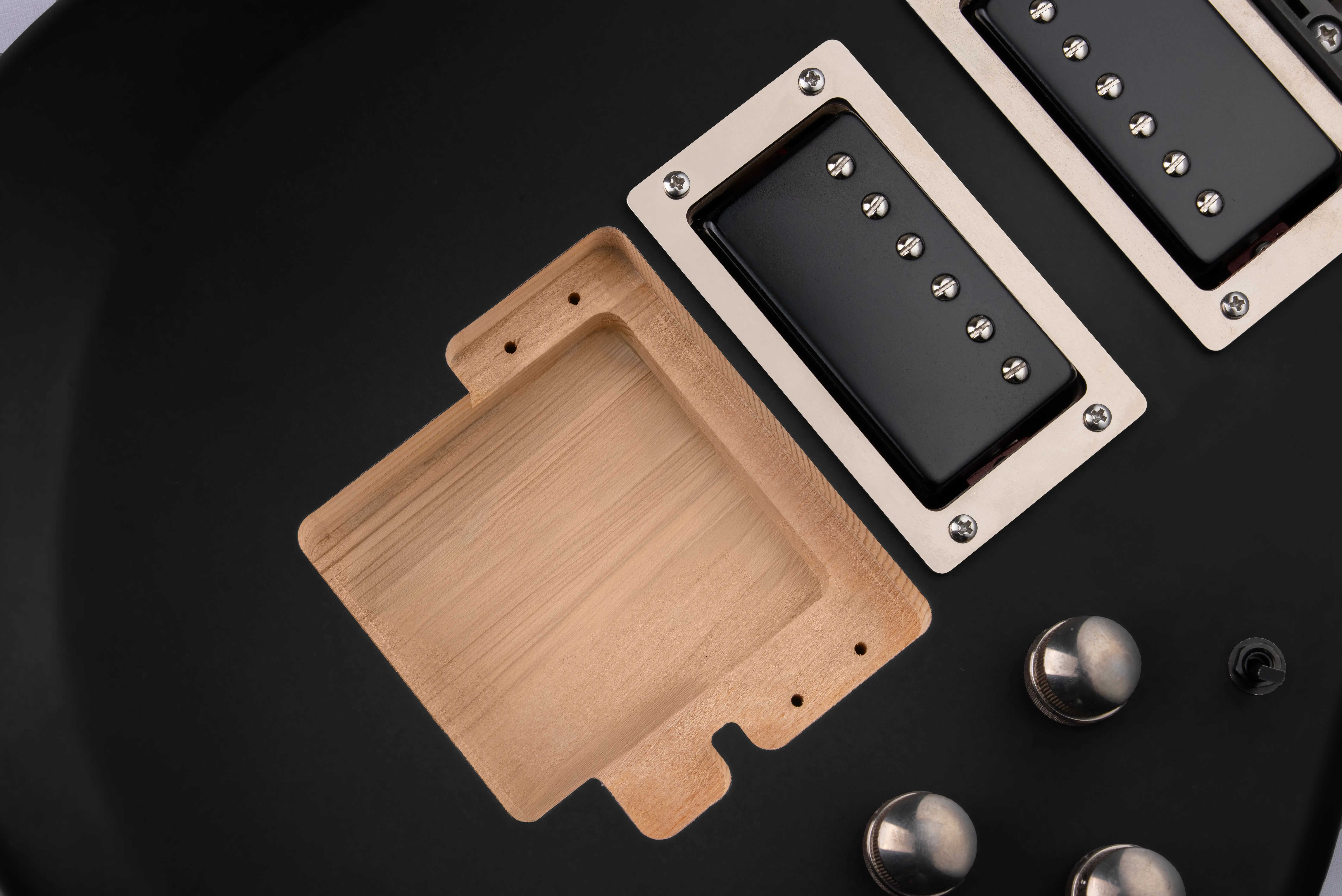 Bridge pocket routed on guitar body